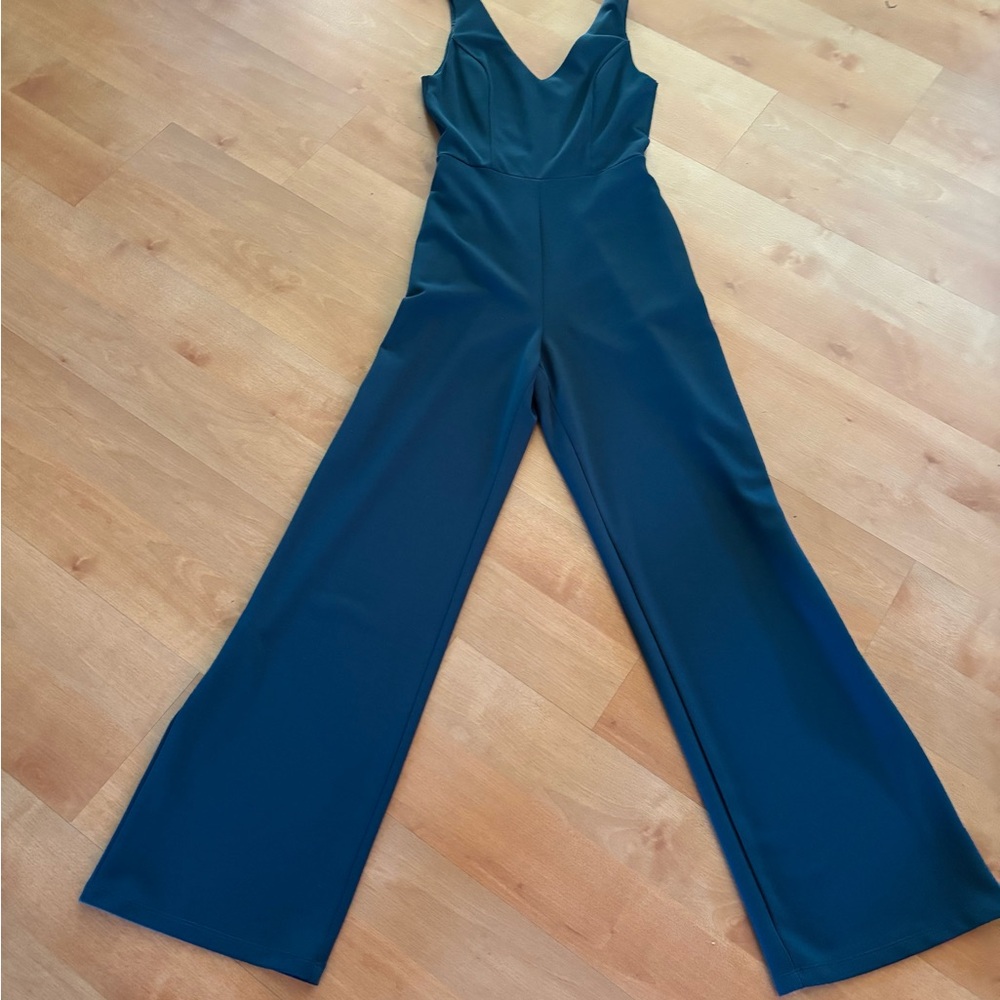 Sleeveless V-Neck Wide-Leg Jumpsuit in Teal. 
Inseam 31”